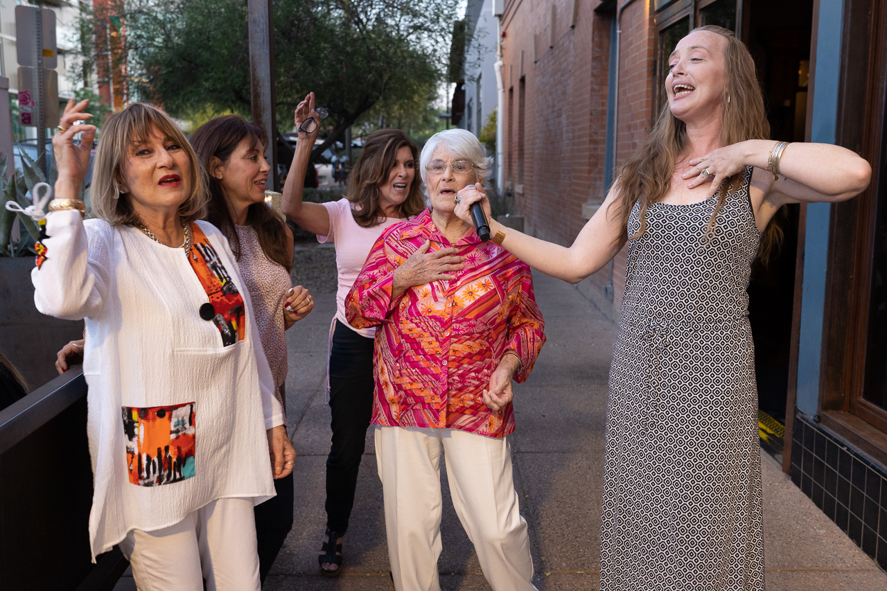 Troubdour Thursdays, an event sponsored by Fox Theatre, featured roving musicians who played short sets at restaurants to encourage the community to come out and enjoy downtown Tucson as the Covid-19 effects were greatly reduced. Here Ms. Olivia engages the audience in singing with her.