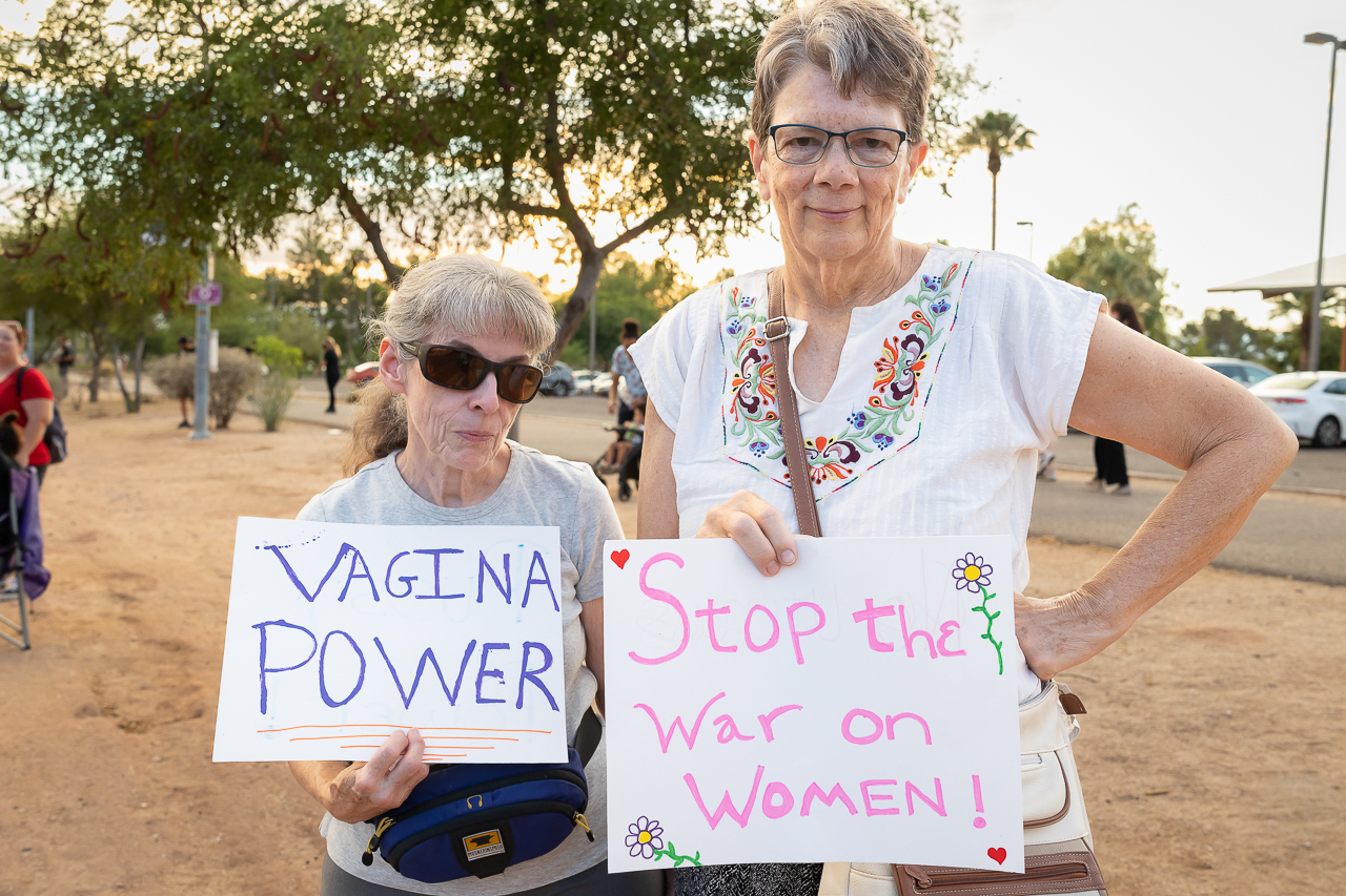 Two women participate in a protest at Reid Park on July 4th, 2022.