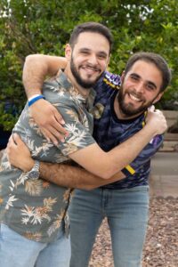 Brothers Mustafa and Bahjat embrace either other during their portrait session with Kathleen Dreier Photography outside their home on 06/13/24. With the support of non-profits Welcome Corp and Community Sponsorship Hub, Mr. Mazen Kashmoola and his son Mustafa were reunited with Bahjat, their son and brother in Phoenix, Arizona. The joyous occasion was documented by Kathleen Dreier Photography.